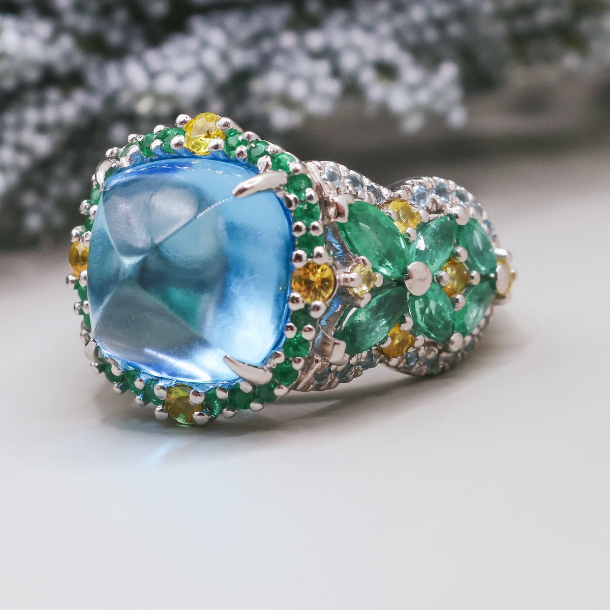 TOPAZ, EMERALD AND SAPPHIRE RING