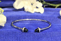 18CT WHITE GOLD & LONDON BLUE TOPAZ CUFF BANGLE