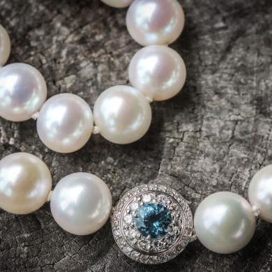 The 18ct White Gold White Cultured Pearl, Aquamarine and Diamond Strand